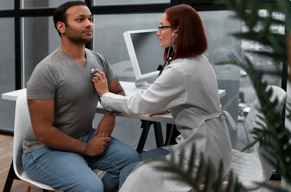 Doctor examining a patient during a full body checkup